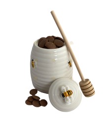 Pot de miel en céramique avec miniatures de chocolat au lait au miel